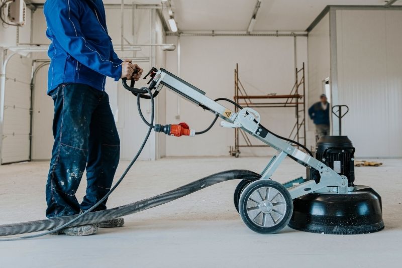 Epoxy floor being polished to a smooth, glossy finish