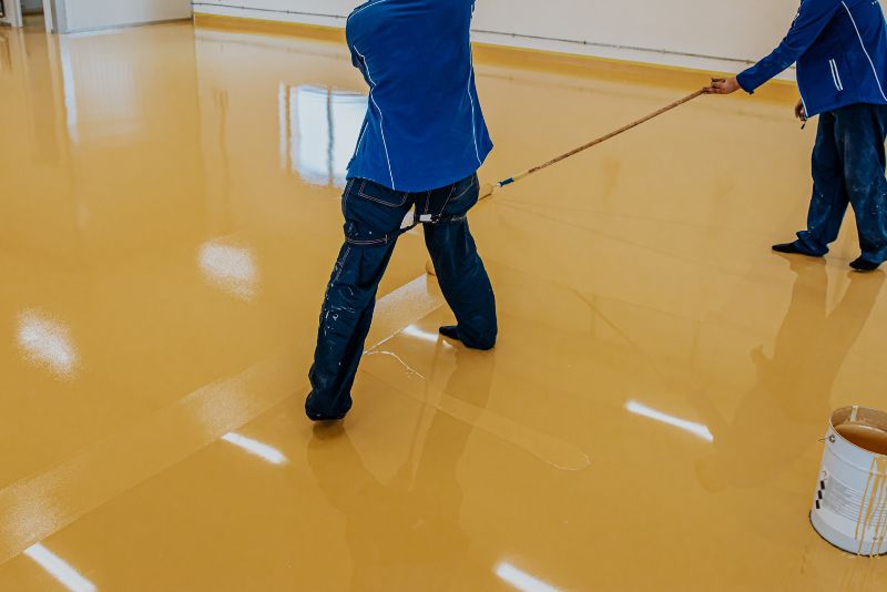 Epoxy floor being polished to a smooth finish for a Hobart client
