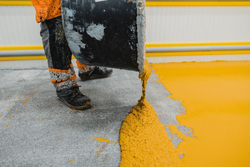 Epoxy and polyurethane mixture being poured for a non-slip floor in Brighton