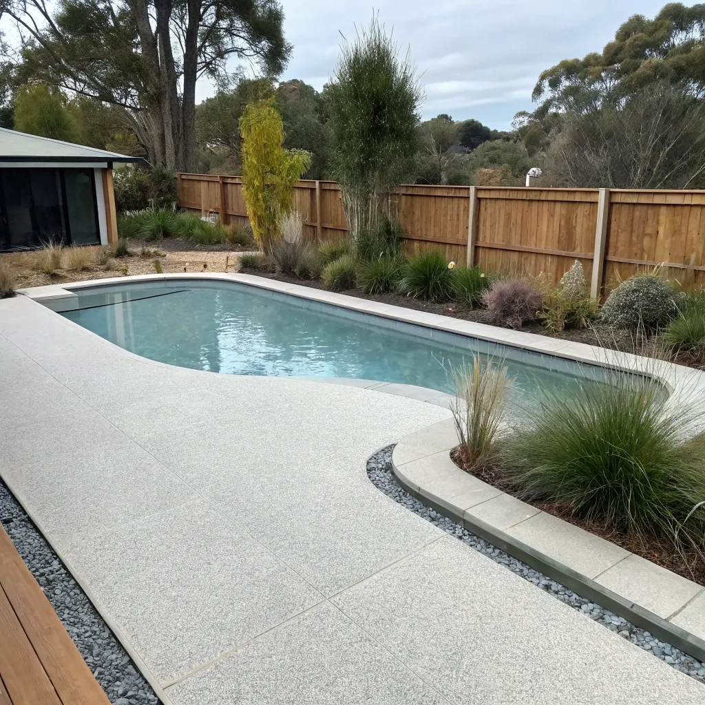 Finished epoxy pool deck coating on a Hobart residential property with light neutral tone